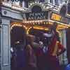 Pluto and Goofy outside the Disneyland Penny Arcade, 1960s